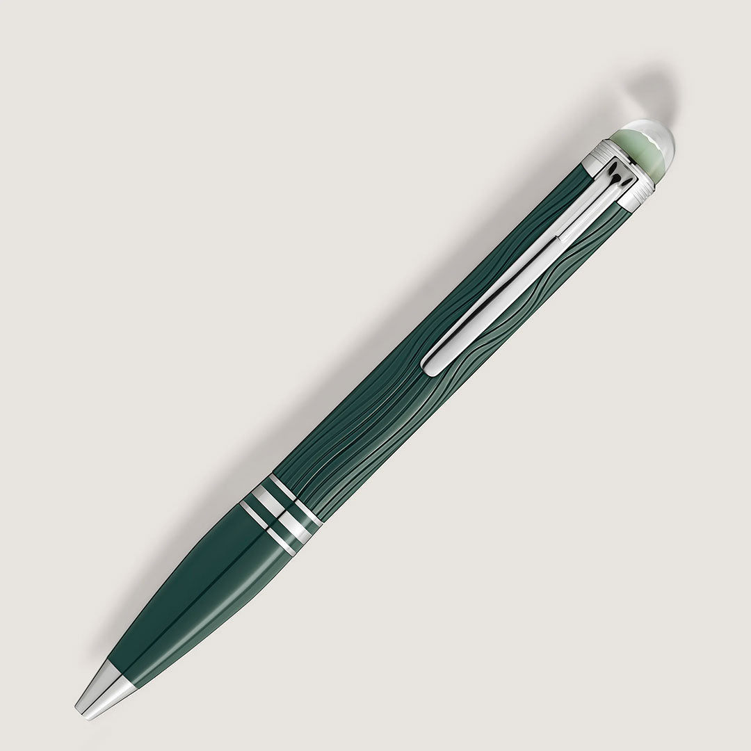 The Montblanc Starwalker Polar Green Precious Resin Ballpoint Pen features a dark green barrel with silver accents, a platinum-coated tip, silver clip, subtle wavy pattern, and a rounded translucent end cap, set against a plain white background.