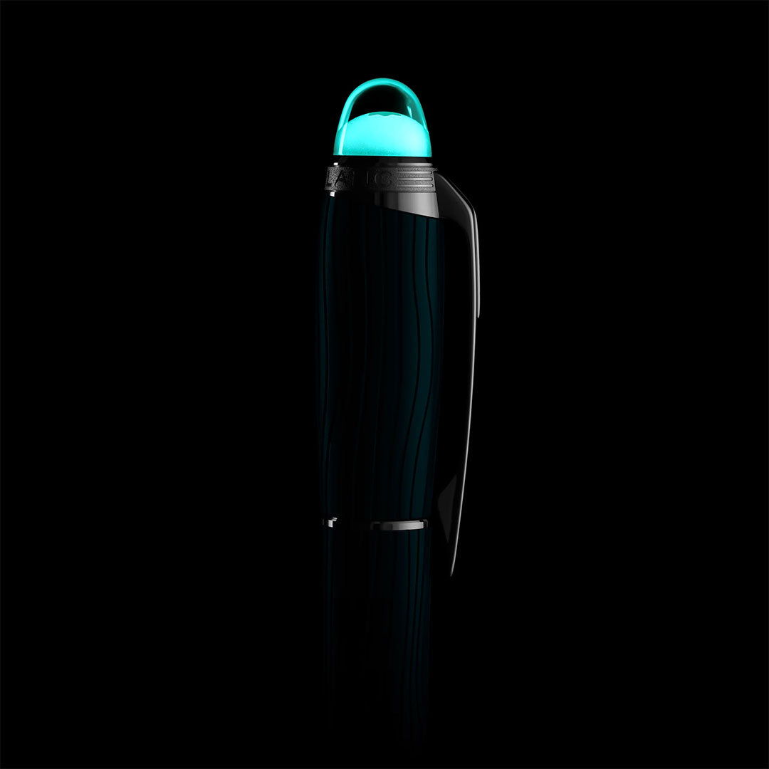 A sleek, dark water bottle with a glowing teal cap stands upright against a black background, its modern design echoing the elegance of the Montblanc Starwalker Polar Green Precious Resin Ballpoint Pen by Montblanc, with subtle reflections enhancing its look.
