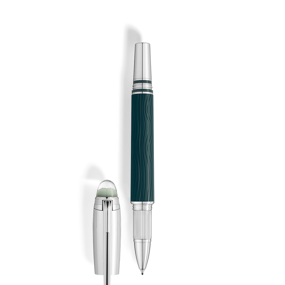 The Montblanc StarWalker PolarGreen Doue Fineliner Pen features a dark green, wavy-textured barrel inspired by the Northern Lights and silver accents, standing upright beside its detached silver cap with a transparent rounded top.