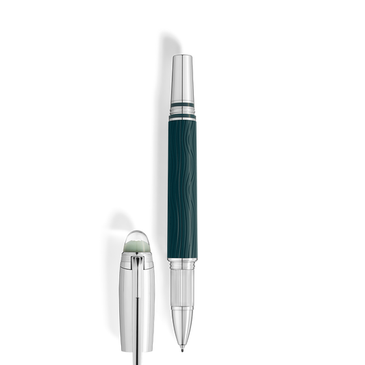 The Montblanc StarWalker PolarGreen Doue Fineliner Pen features a dark green, wavy-textured barrel inspired by the Northern Lights and silver accents, standing upright beside its detached silver cap with a transparent rounded top.
