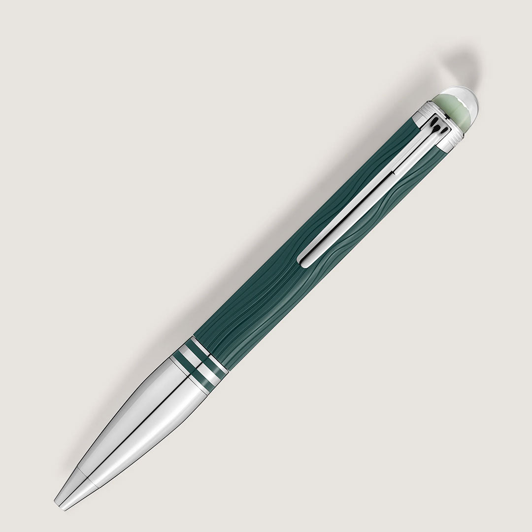 The Montblanc Starwalker Polar Green Precious Resin Doue Ballpoint Pen features a green and silver textured body, platinum-coated details, metallic clip, and two silver rings near the tip, shown diagonally on a light background.