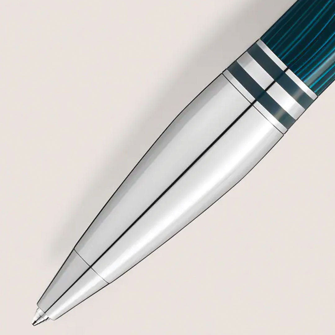 A close-up of the Montblanc Starwalker Polar Green Ballpoint Pen, featuring dark green and silver accents, is shown positioned diagonally on a light background.