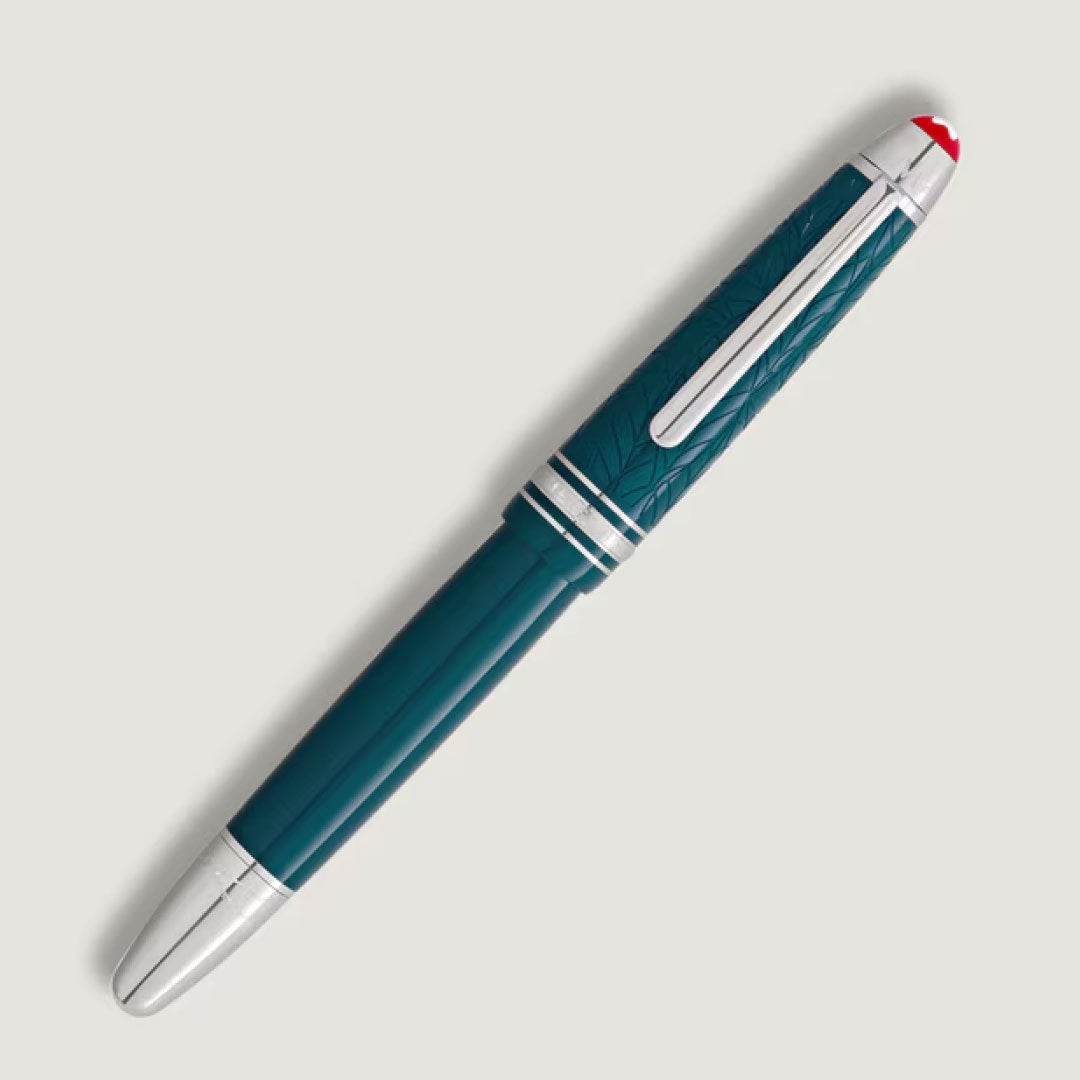 The Montblanc Meisterstück Romeo & Juliet LeGrand Fountain Pen is a luxury teal and silver writing instrument with an engraved cap, silver accents, and a red top detail, inspired by the iconic Montblanc design.