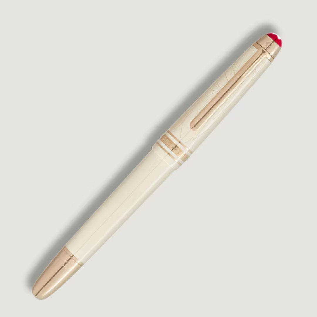A cream Montblanc Meisterstück Romeo & Juliet Classique Fountain Pen with gold accents and a red-tipped cap, made of precious resin, is displayed diagonally on a light gray background.