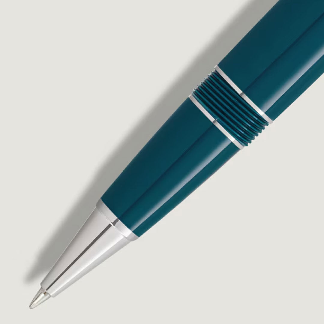 A close-up of the Montblanc Meisterstuck Romeo & Juliet LeGrand Rollerball Pen, featuring silver accents and a ribbed grip, crafted from precious resin by Montblanc, resting on a light gray background.