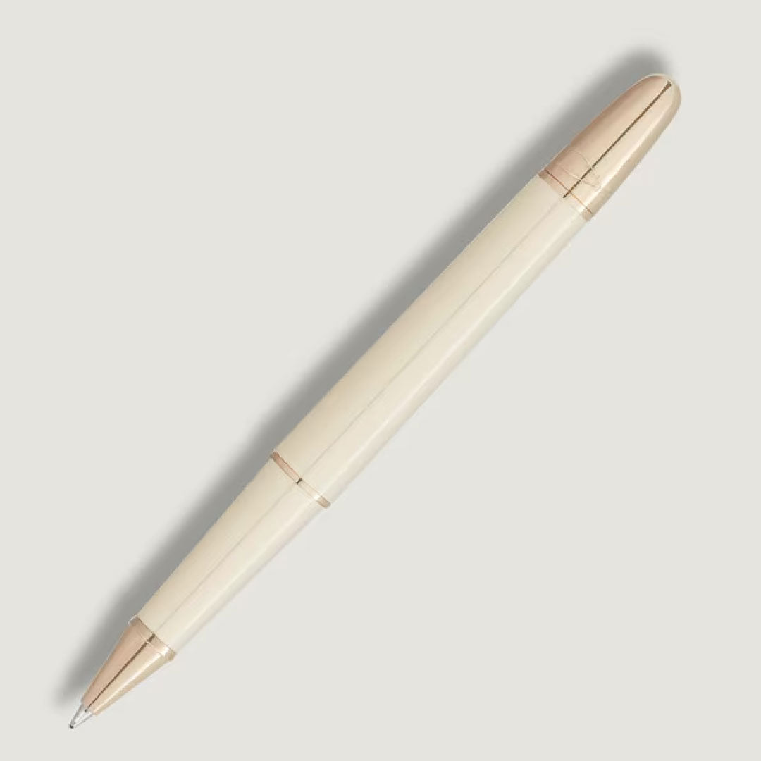 The Montblanc Meisterstück Romeo & Juliet Doue Classique Rollerball Pen features a cream finish with gold accents and a sleek, modern design, elegantly displayed against a light background.
