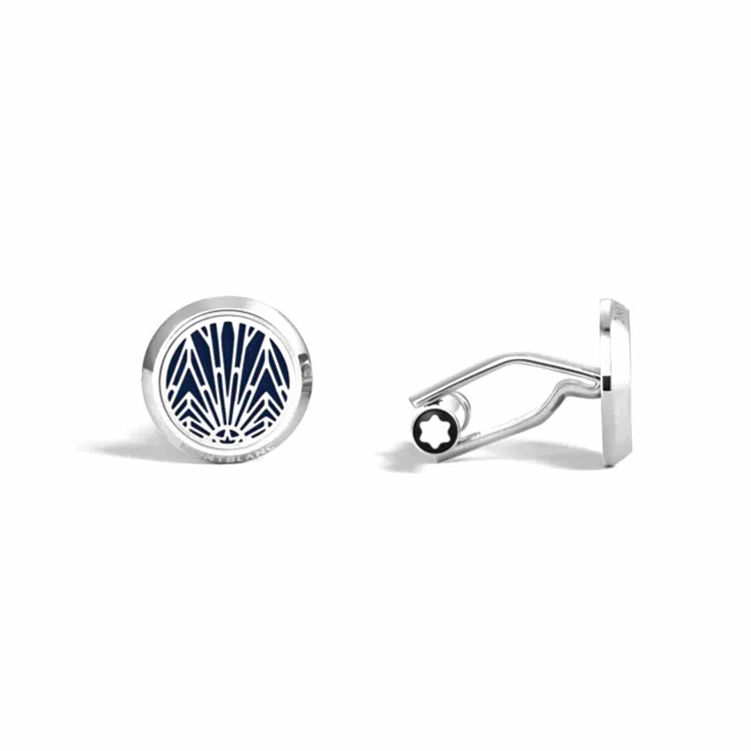 The Montblanc Meisterstuck The Origin Collection Blue Cufflinks includes two silver round cufflinks. One is crafted from stainless steel and features a navy blue and white geometric pattern reminiscent of sun rays, while the other highlights the distinctive back and closure mechanism specific to Meisterstück cufflinks by Montblanc.