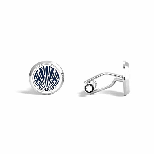 The Montblanc Meisterstuck The Origin Collection Blue Cufflinks includes two silver round cufflinks. One is crafted from stainless steel and features a navy blue and white geometric pattern reminiscent of sun rays, while the other highlights the distinctive back and closure mechanism specific to Meisterstück cufflinks by Montblanc.