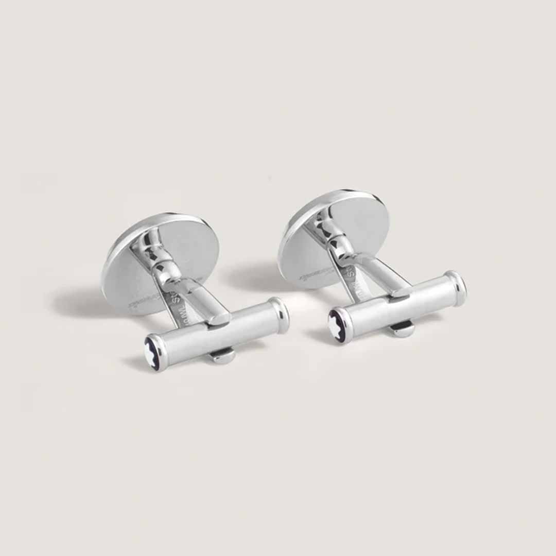 A pair of Montblanc Meisterstück The Origin Collection Blue Cufflinks, featuring a sophisticated cylindrical design in stainless steel, accented with distinct black stripes at each end, displayed against a neutral background.