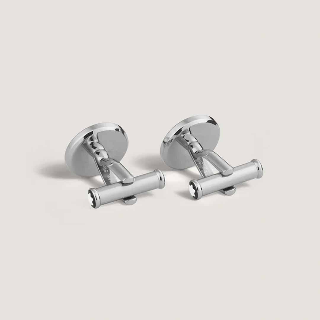 Montblanc's Great Characters Homage to The Great Gatsby Cufflinks feature a sleek stainless steel design set against a light gray background. With their cylindrical bar and polished finish, these cufflinks capture the minimalist elegance reminiscent of the timeless style found in The Great Gatsby.