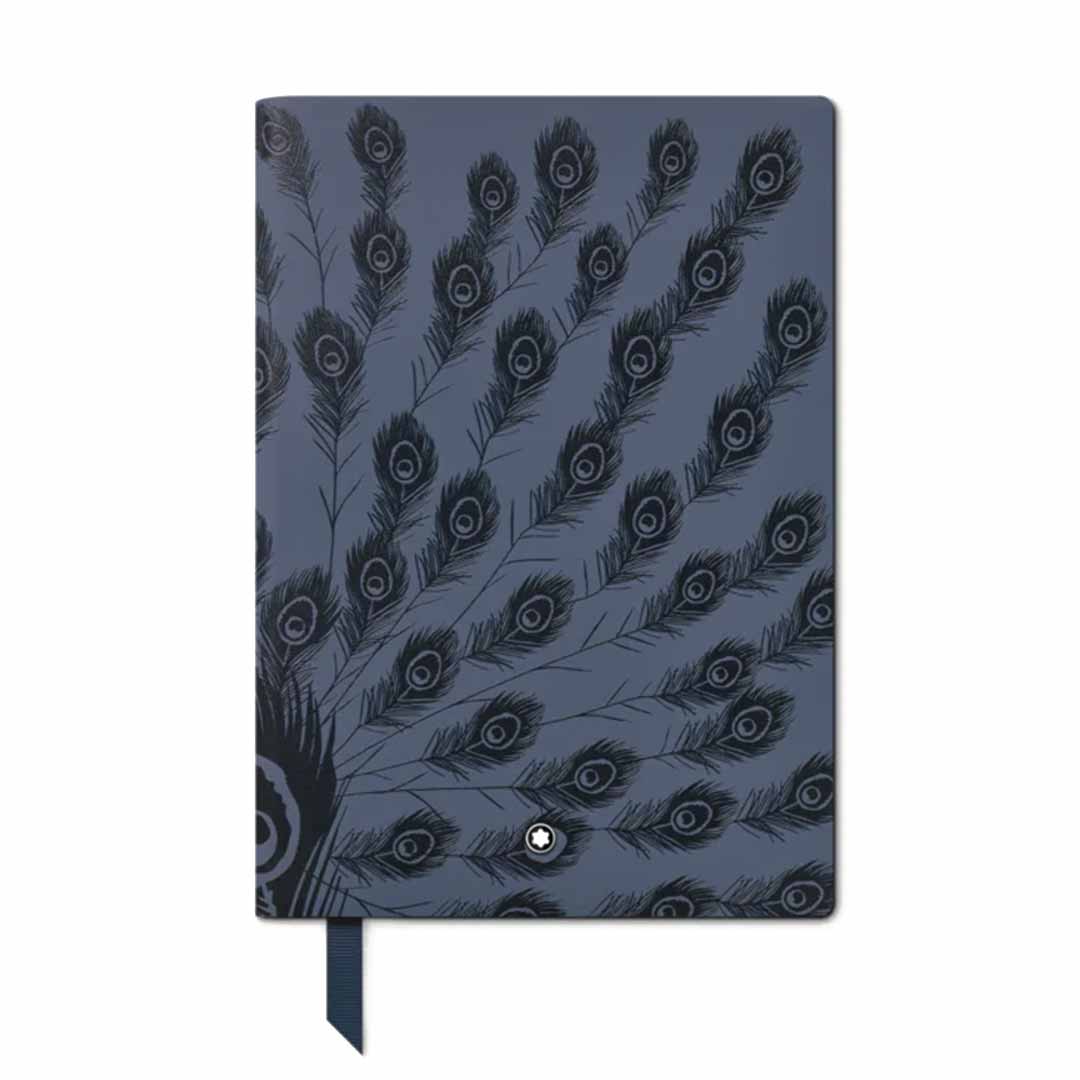 Introducing the Montblanc #146 Writers Edition Homage to Jane Austen Notebook, a closed notebook with a dark blue leather cover adorned with an elegant peacock feather pattern, capturing Jane Austen's timeless charm. It comes complete with a matching blue ribbon bookmark extending from the bottom.