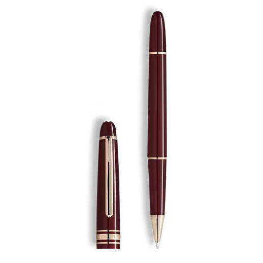 A Montblanc Meisterstück Burgundy Red Classique Rollerball Pen, shown uncapped with the cap standing upright beside the pen on a white background.