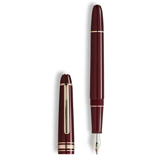 A Montblanc Meisterstuck Burgundy Red Classique Fountain Pen by Montblanc, shown uncapped with the gold nib revealed and the cap placed beside the pen.