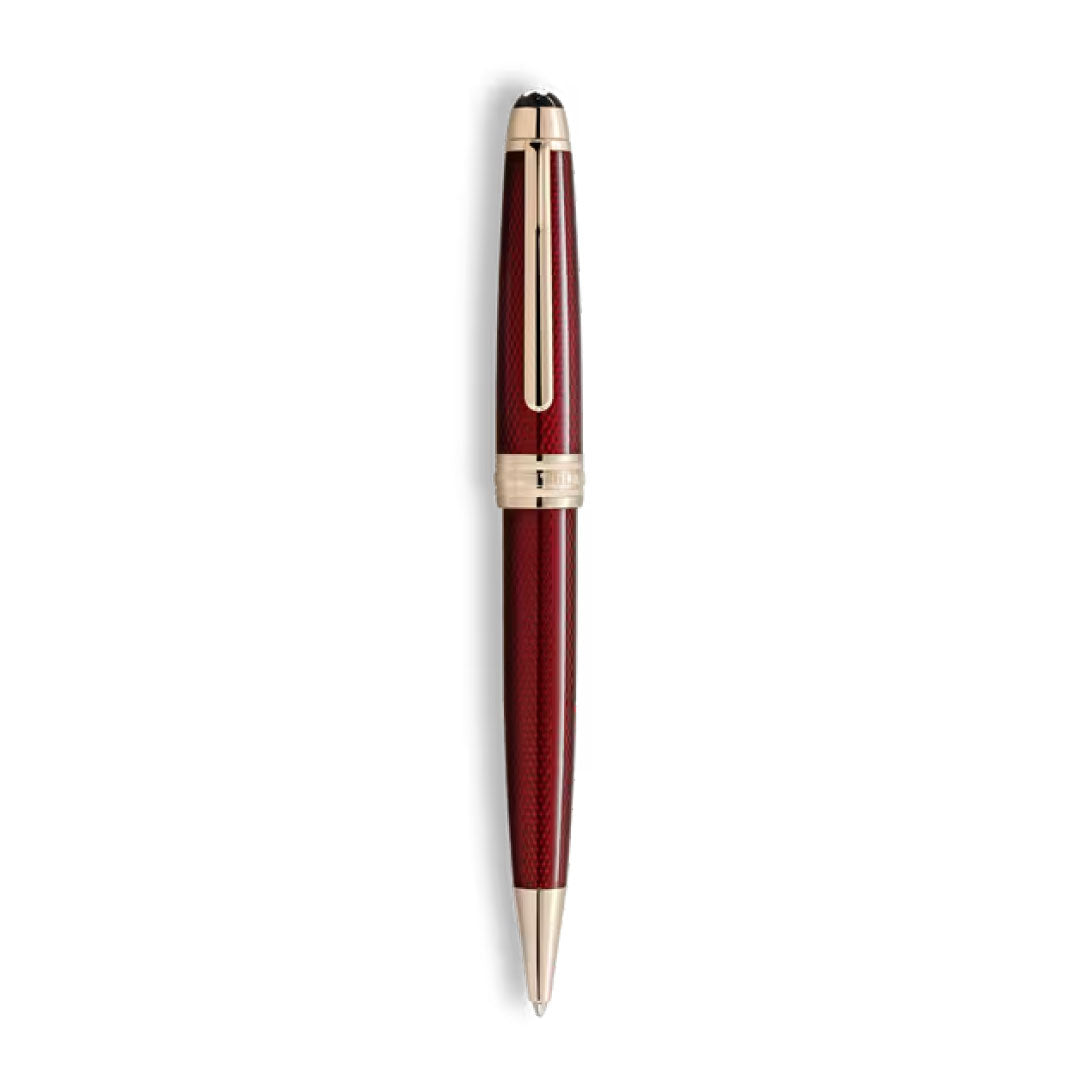 The Montblanc Meisterstück Solitaire Golden Hour Ballpoint Pen, featuring burgundy red lacquer and gold-coated clip and trim, is displayed vertically against a white background.