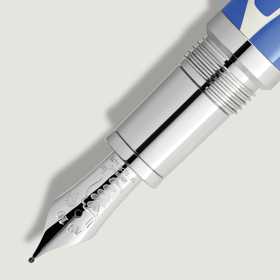 Close-up of the finely engraved silver nib of the Montblanc Masters of Art Homage to Henri Matisse Limited Edition 4810 Fountain Pen, shown attached to its blue and white barrel against a light gray background.