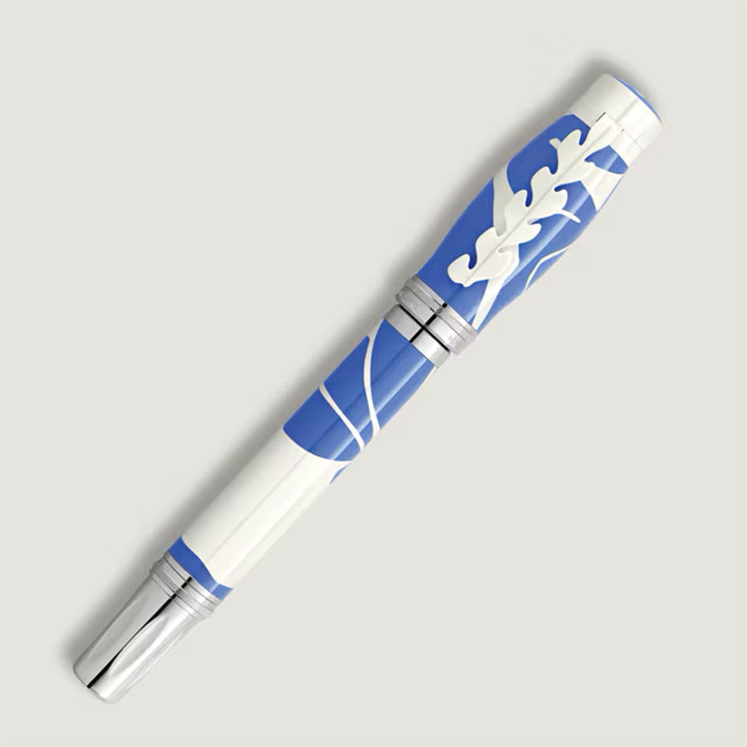 The Montblanc Masters of Art Homage to Henri Matisse Limited Edition 4810 Rollerball Pen features a blue and white abstract leaf design with silver accents, displayed against a light gray background.