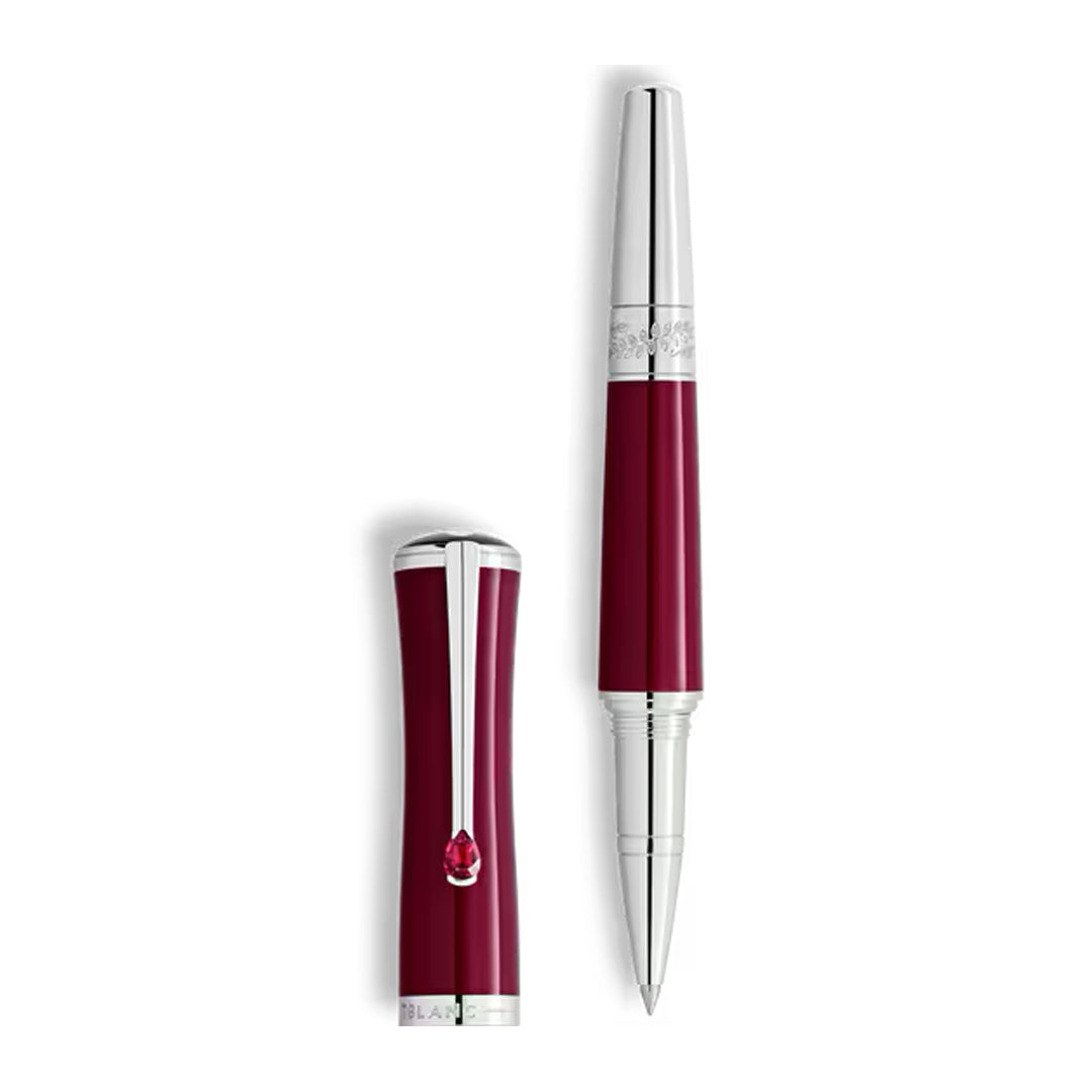The Montblanc Maria Callas Special Edition Rollerball Pen features a shiny burgundy barrel, silver accents, and a removable cap with a silver clip and red jewel, reflecting the elegance of its operatic namesake.