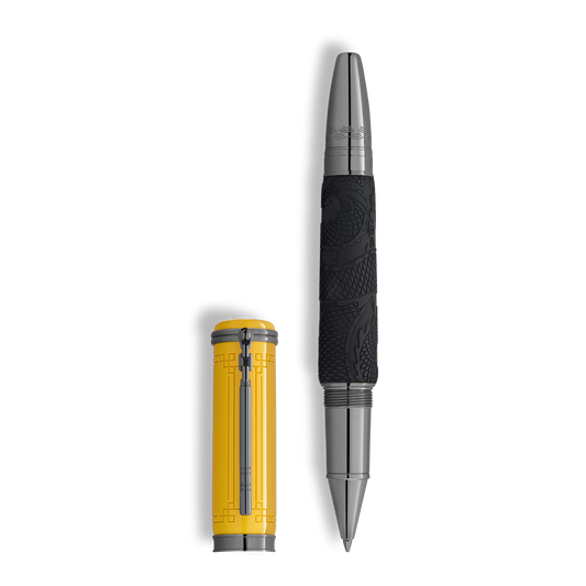 Montblanc Great Characters Bruce Lee Special Edition Rollerball Pen with a yellow cap featuring geometric patterns and a black, textured barrel with a subtle dragon motif.