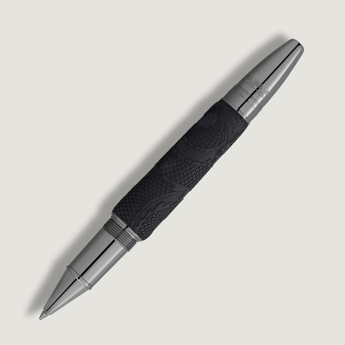 Montblanc Great Characters Bruce Lee Special Edition rollerball pen with a black barrel featuring an embossed dragon design and polished silver-colored metal fittings.