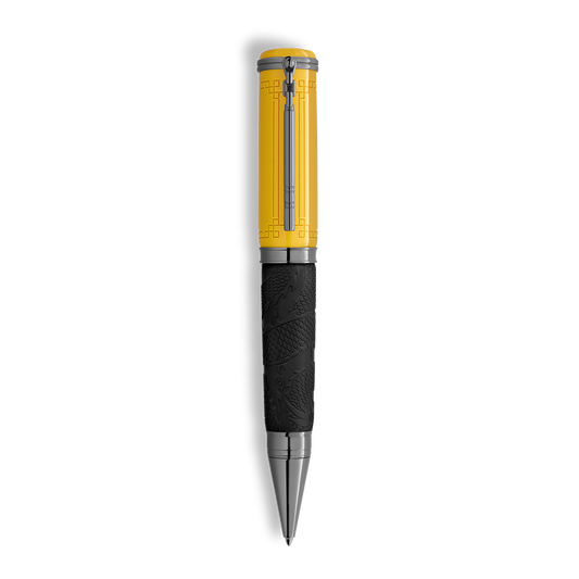 Yellow Montblanc Great Characters Bruce Lee Special Edition ballpoint pen featuring a geometric pattern on the cap and a black barrel with an embossed dragon design.