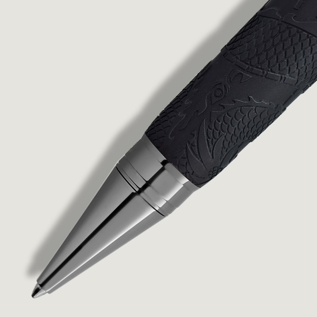 Black Montblanc Great Characters Bruce Lee Special Edition ballpoint pen with a dragon-patterned grip and a metallic silver tip.