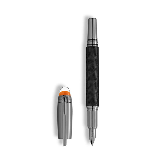 The Montblanc StarWalker Extreme Doue Fountain Pen by Montblanc, shown in silver and black with a textured grip, rests beside its matching cap featuring a ruthenium-coated finish and an orange accent on top, set against a white background.