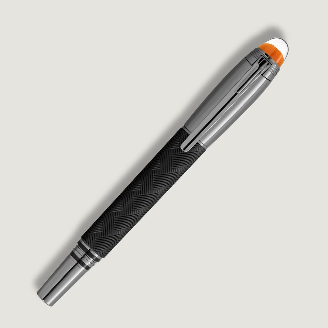 The Montblanc StarWalker Extreme Doue Fineliner Pen features a black and silver zigzag-patterned barrel, ruthenium-coated chrome clip, and orange cap accent, shown against a light gray background.