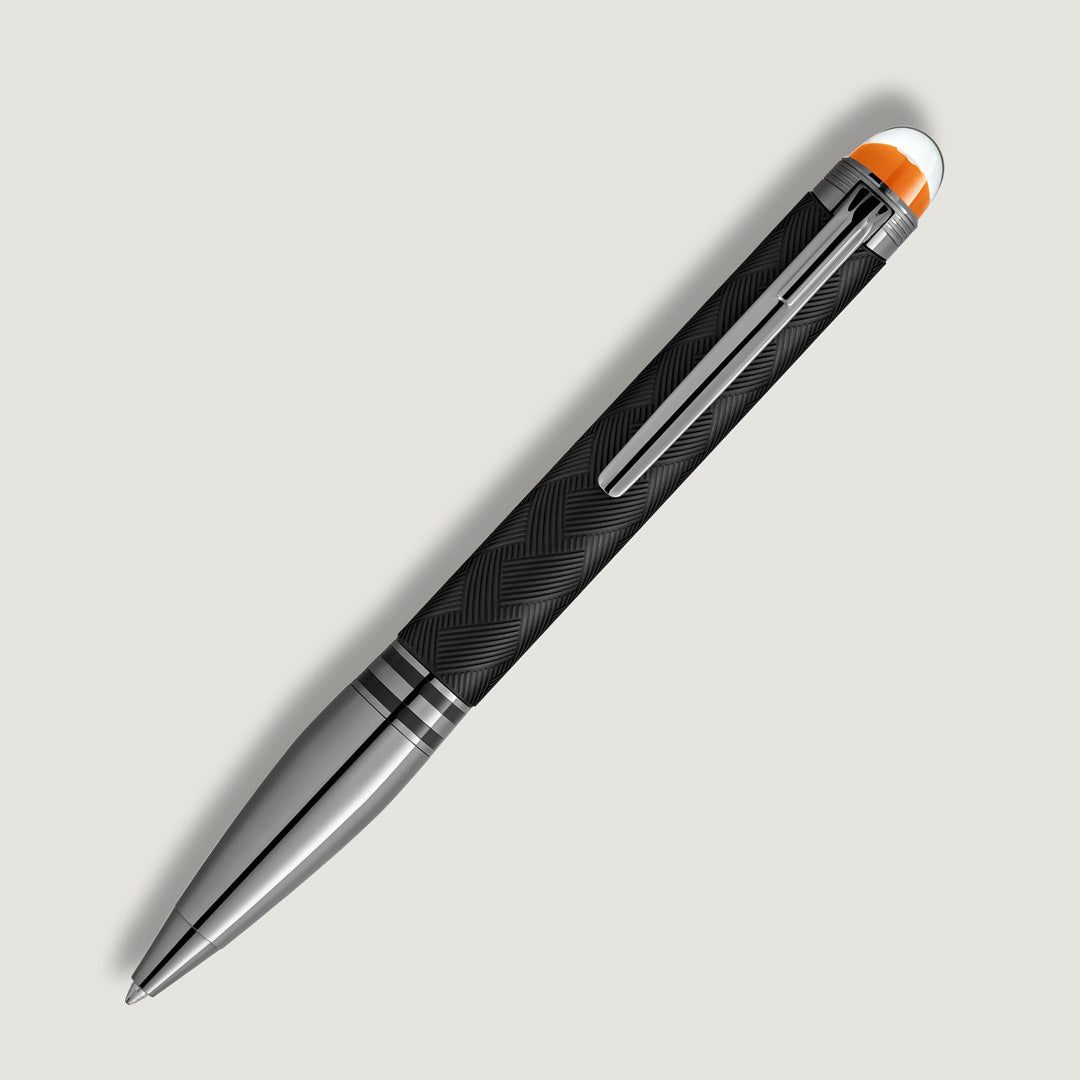 The Montblanc StarWalker Extreme Doue Ballpoint Pen features a sleek black textured barrel, silver accents, a silver clip, and orange and white top details, all set against a light gray background.