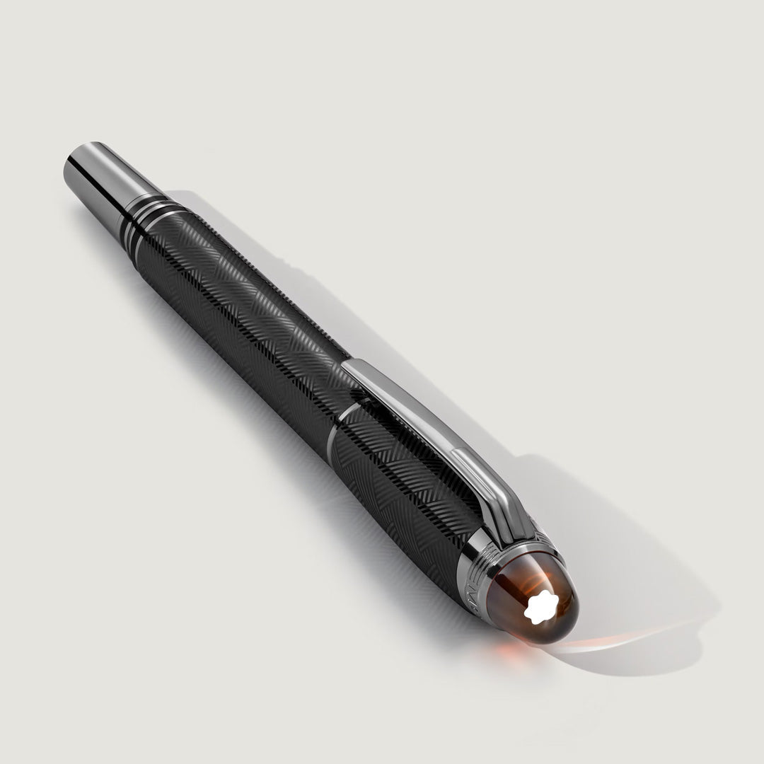 The Montblanc StarWalker Extreme Metal Fineliner Pen features a textured barrel, ruthenium-coated silver clip, and white star emblem on the cap—a black luxury icon from Montblanc, shown on a light gray surface with a subtle shadow.