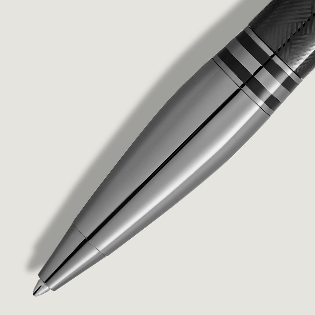 A close-up of the Montblanc StarWalker Extreme Metal Ballpoint Pen shows its sleek metallic design with ruthenium-coated fittings, textured grip, and distinctive dark and light bands—reflecting Montblanc’s luxury craftsmanship.