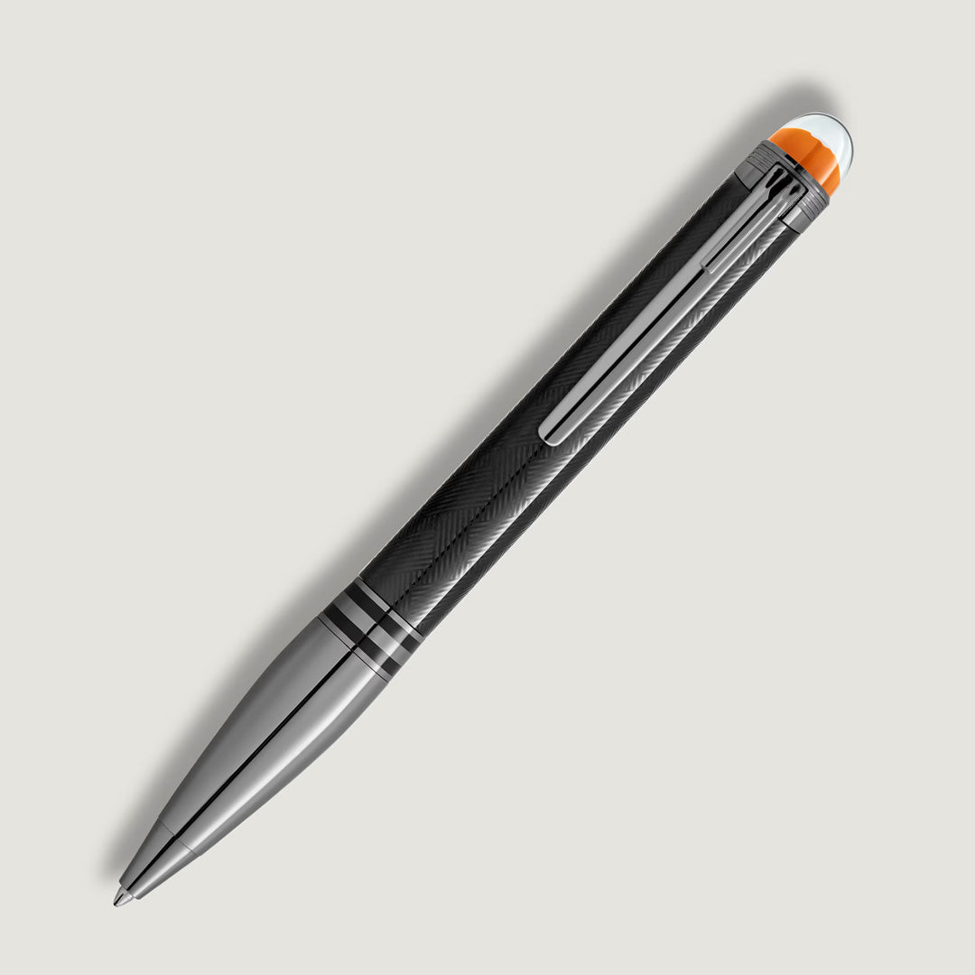 The Montblanc StarWalker Extreme Metal Ballpoint Pen features a black and silver design, textured grip, ruthenium-coated fittings, metal clip, and orange accent—an elegant luxury writing instrument displayed on a light gray background.