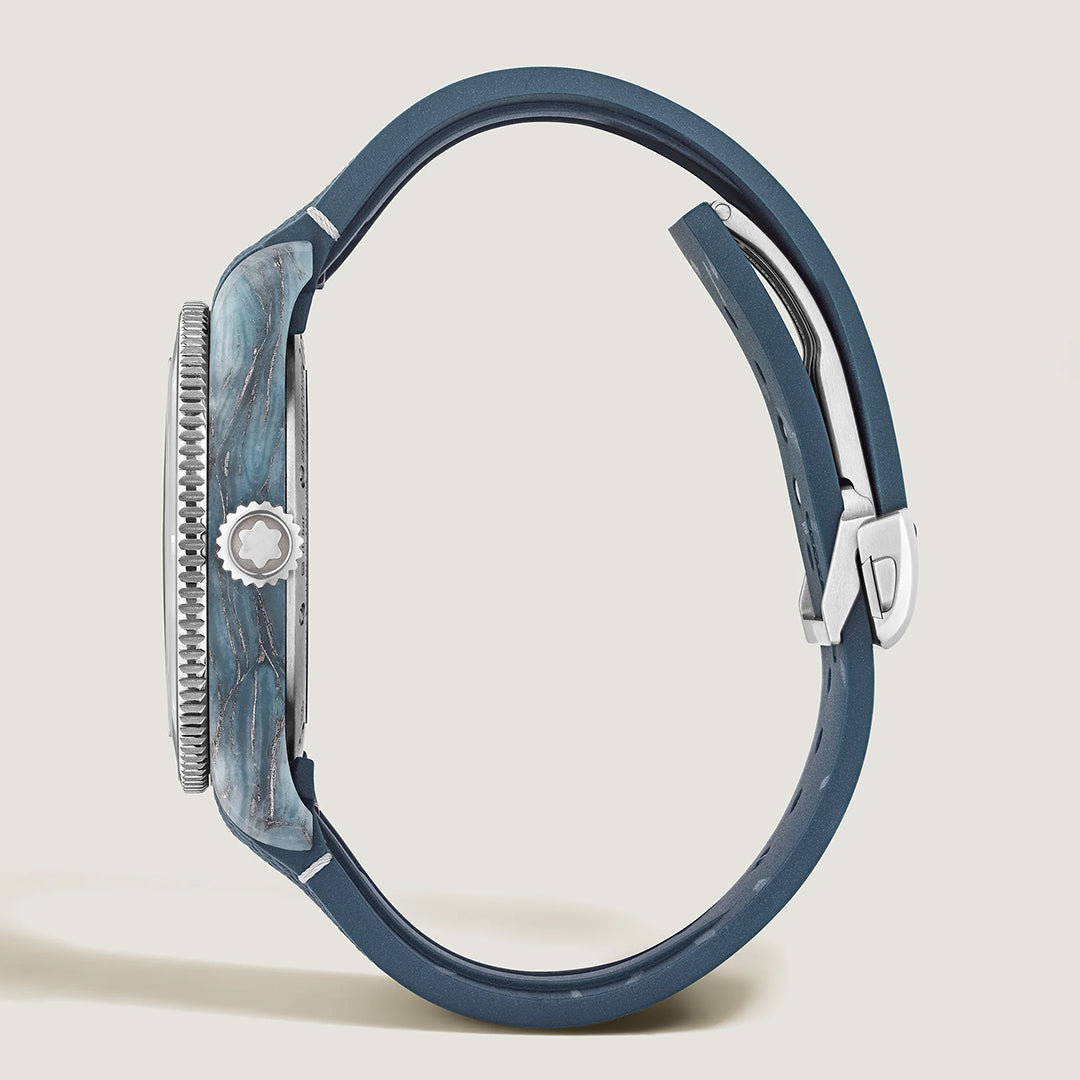 A side view of the Montblanc 1858 Geosphere 0 Oxygen Mount Vison Automatic 43.5mm Limited Edition watch with a blue strap, silver case, textured crown, and marbled blue-gray case side against a plain light background.