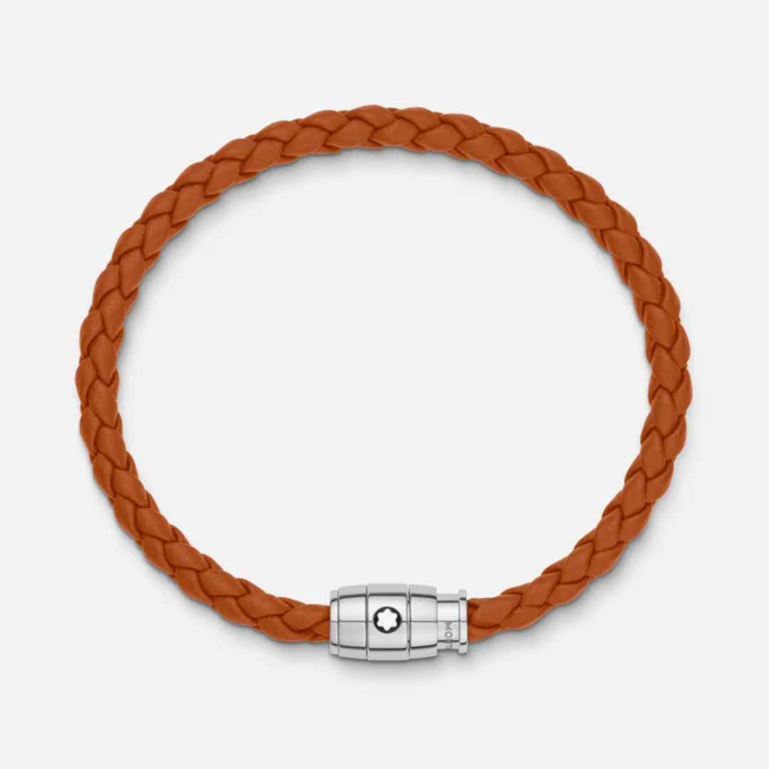 The Montblanc Meisterstuck Collection Steel 3-Ring Rust Leather Bracelet, crafted from braided brown leather with a stainless steel clasp showcasing the iconic Montblanc emblem, is displayed circular and flat against a simple white background.