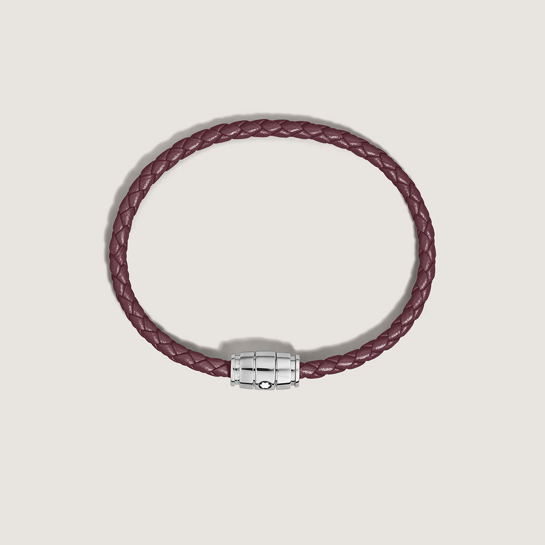 The Montblanc Meisterstuck 3 Rings Cassis Leather Bracelet features braided cassis calfskin and a silver clasp with the Montblanc emblem, showcased against a plain light background.