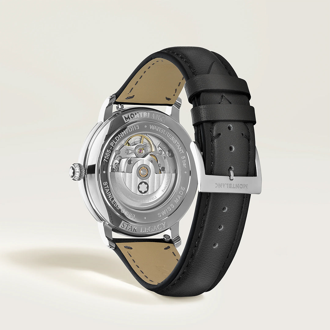 A close-up of the Montblanc Star Legacy Automatic Date 42mm Watch showcases its intricate automatic movement through a transparent case back, black leather strap, and "Montblanc" engraved clasp.