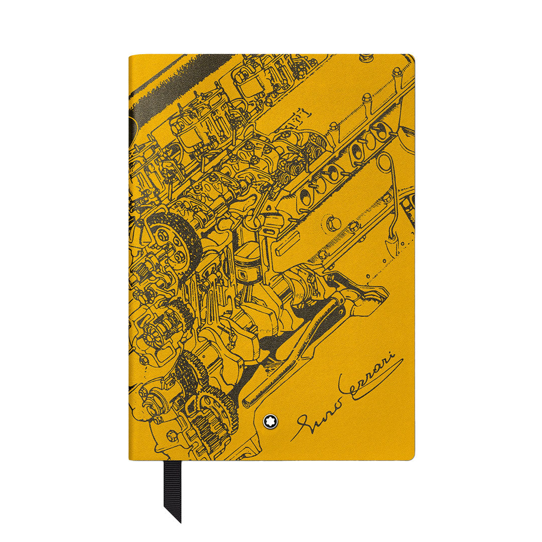The Montblanc Great Characters Enzo Ferrari Giallo Modena #146 Small Notebook features a detailed black engine line drawing and "Enzo Ferrari" signature on the cover, with a black ribbon bookmark and lined pages.
