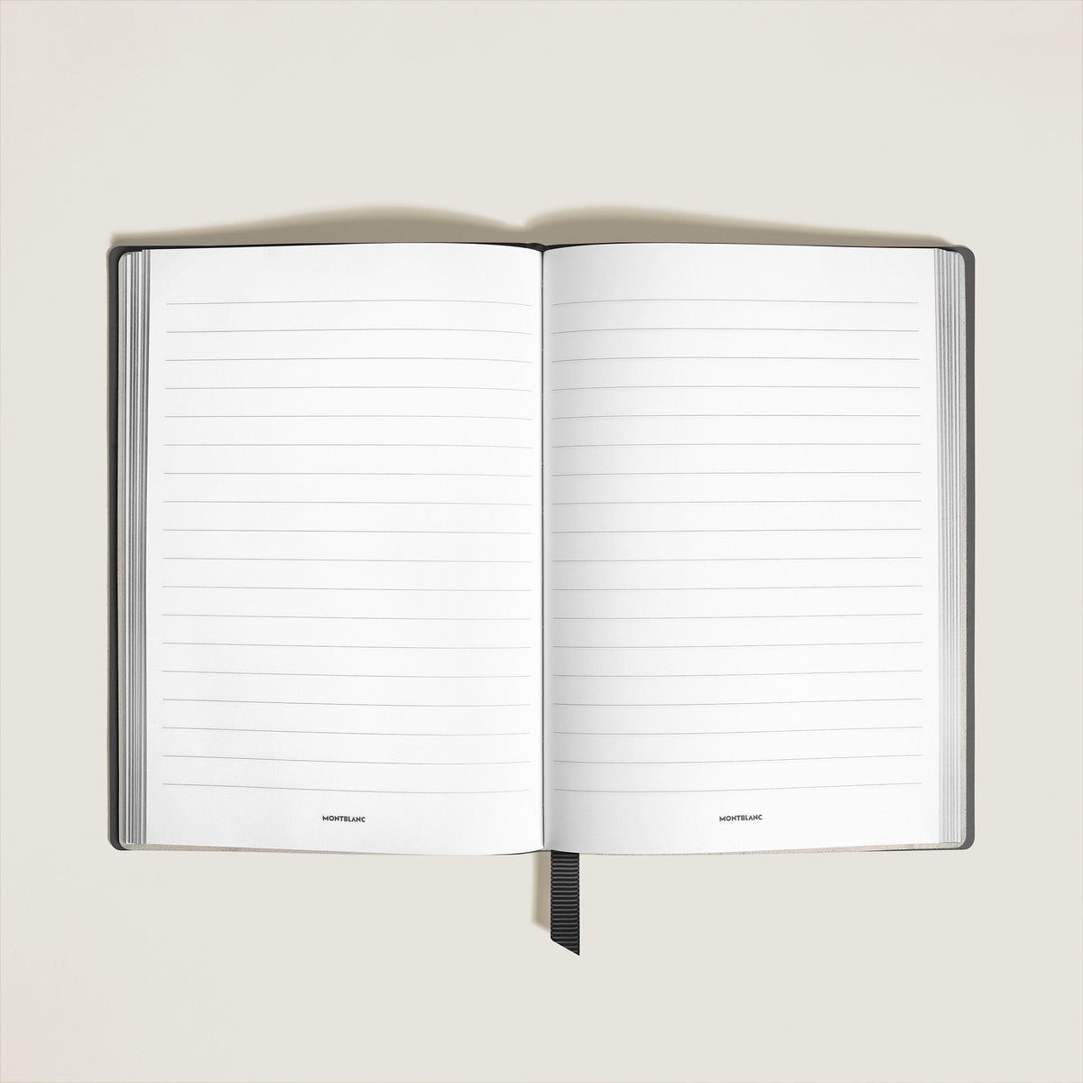 Open Montblanc Notebook Medium Saffiano Leather Black - Lined Pages with lined pages and a black ribbon bookmark.