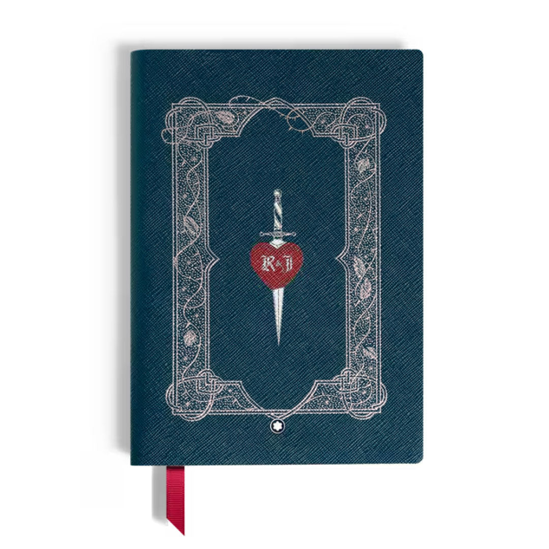 The Montblanc Meisterstuck Romeo & Juliet Medium Notebook features dark teal handcrafted Italian leather with a decorative border and a silver dagger piercing a red heart labeled "R+J" at the center, plus a red ribbon bookmark.