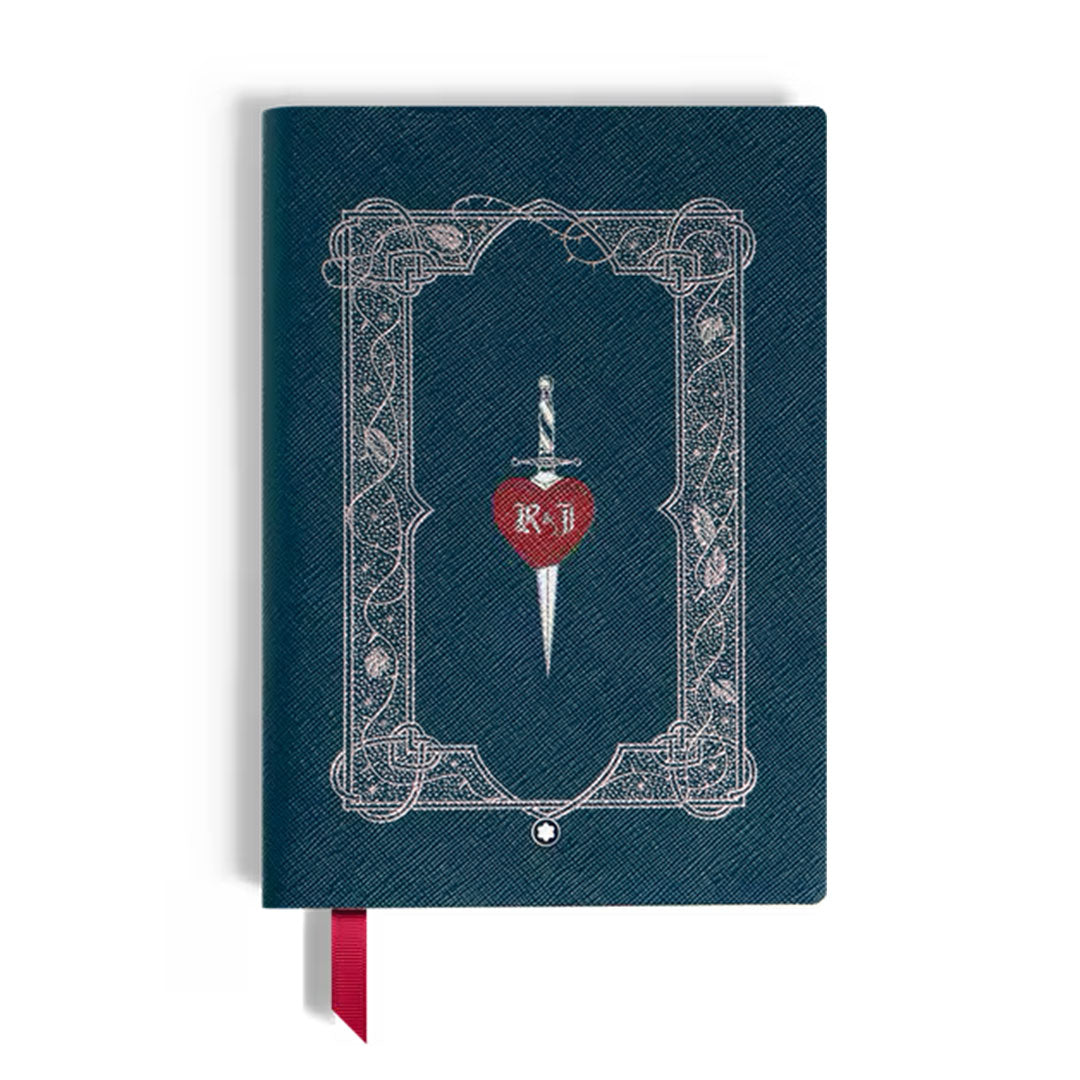The Montblanc Meisterstück Romeo and Juliet Medium Notebook by Montblanc is a blue textured leather notebook with an ornate silver frame, a dagger piercing a red heart with "R + J," a red ribbon bookmark, and is handcrafted in Italy.