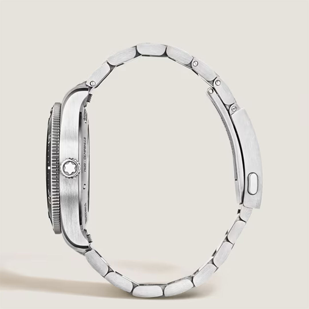 A Montblanc Iced Sea Automatic Date 0 Oxygen 38mm Watch with a silver metal band is shown from the side on a plain light background, emphasizing its round face, bezel, and unique black glacier dial.