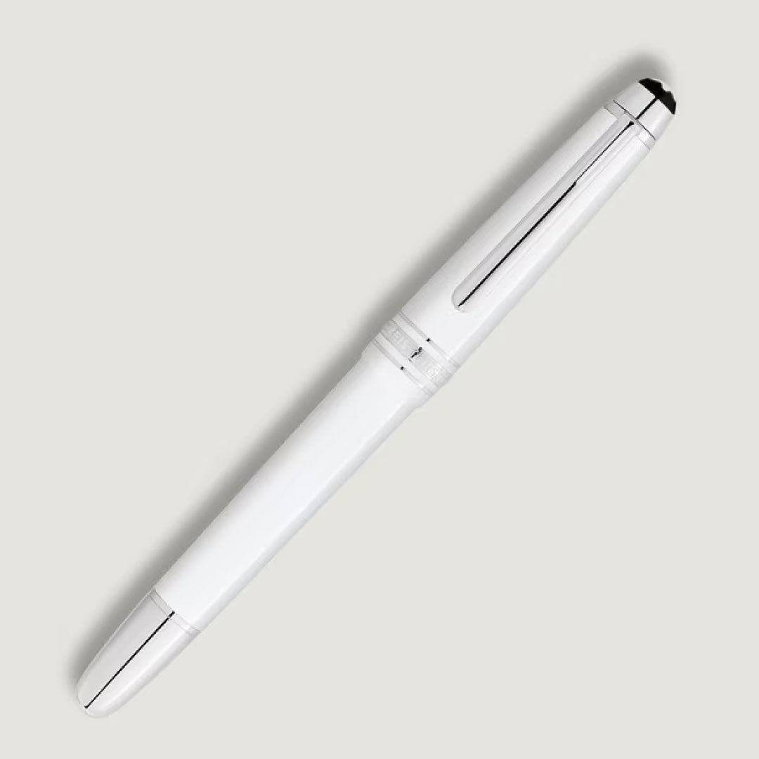 The Montblanc Meisterstuck White Classique Fountain Pen M, featuring white resin and silver accents, is displayed diagonally on a light gray background.