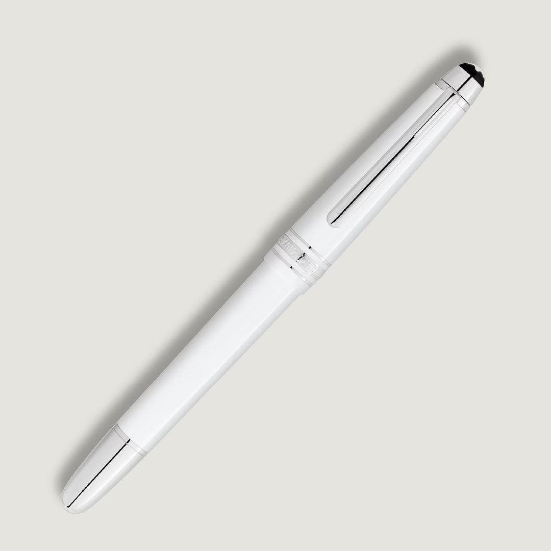 The Montblanc Meisterstuck White Classique Rollerball Pen features platinum-coated silver accents and a black tip, shown diagonally on a light grey background.