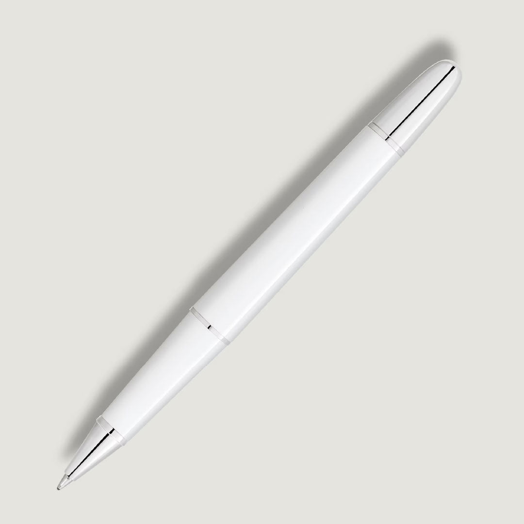 The Montblanc Meisterstuck White Classique Rollerball Pen features platinum-coated silver accents and is shown diagonally on a light gray background.
