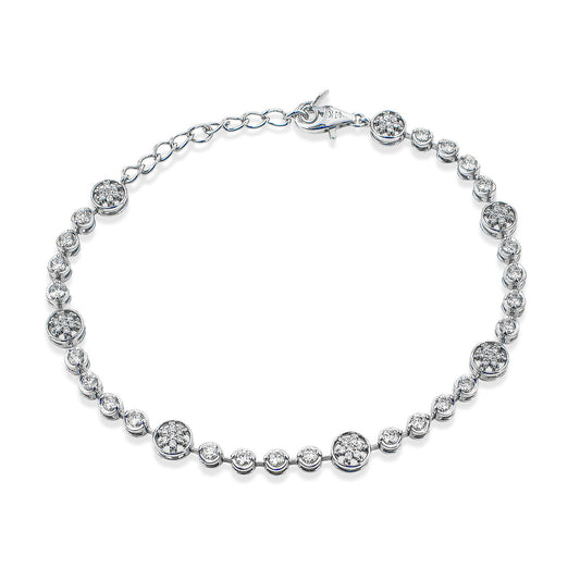 The Simon G 18K White Gold Diamond Bracelet boasts round diamonds set in luxurious 18 Karat white gold, complemented by diamond-like gemstones evenly distributed across the chain and secured with a convenient lobster clasp closure.