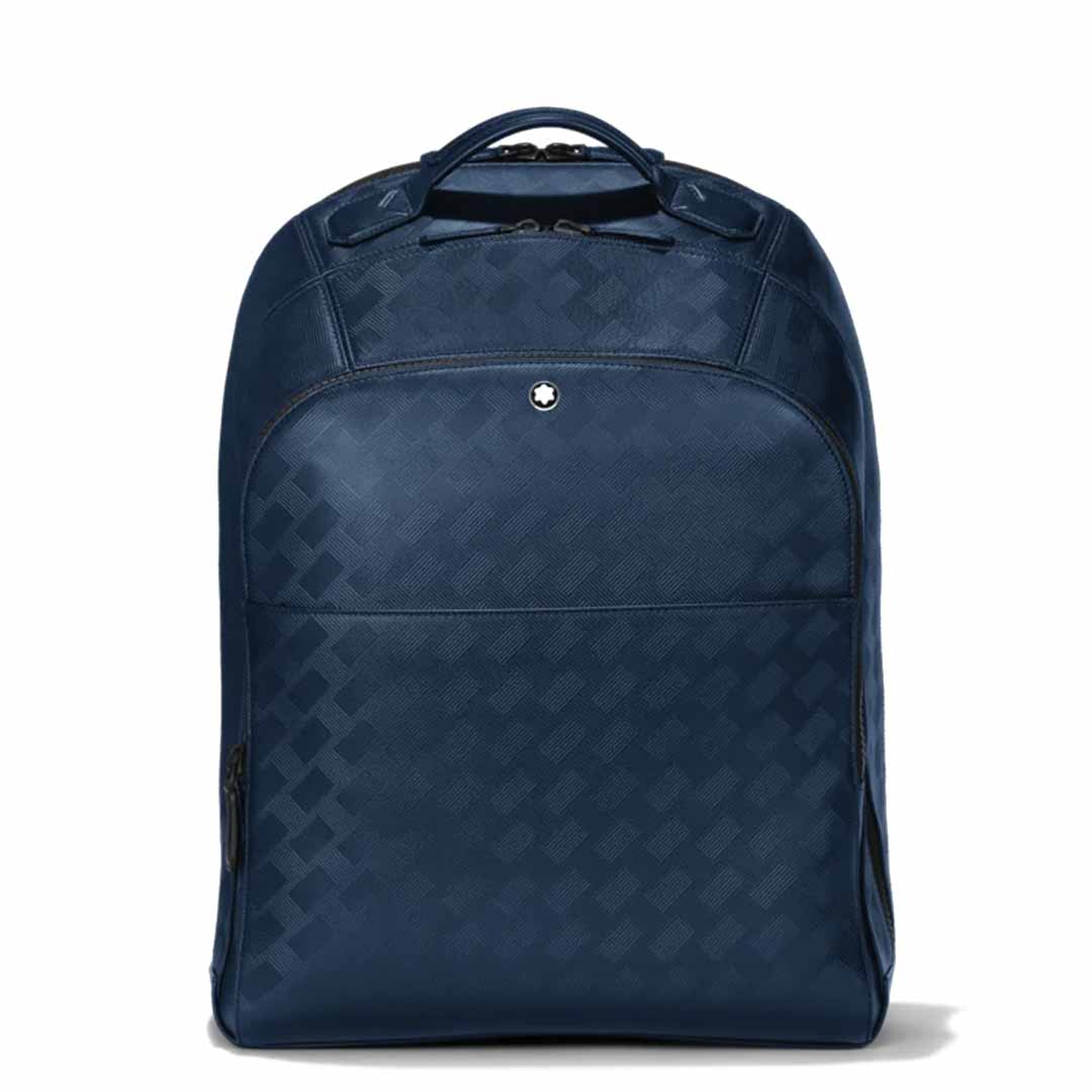 The Montblanc Extreme 3.0 Blue Leather Backpack showcases a sleek and stylish dark blue design with a subtle checkered pattern. Its trendy appeal is enhanced by an embossed full-grain leather top handle that adds sophistication. The backpack includes a practical front pocket and a small round logo, while the padded laptop compartment ensures functionality without compromising on style.