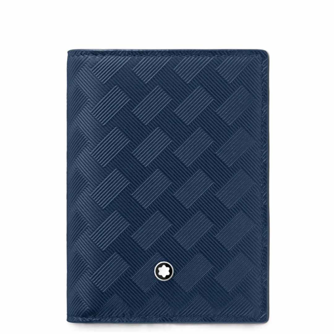 Introducing the Montblanc Extreme 3.0 4cc Leather Blue Card Holder by Montblanc, a stylish accessory crafted from full-grain leather in navy blue. This card holder features a textured geometric pattern and is adorned with a small circular emblem showcasing a star design at the bottom center. The design includes convenient credit card slots to ensure optimal organization.