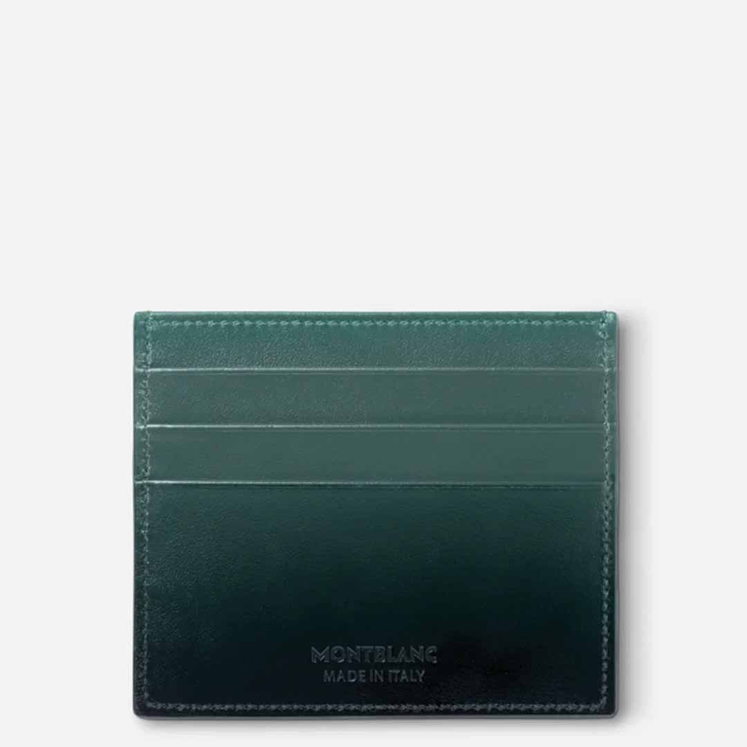 The Montblanc Meisterstuck 6cc Leather Card Holder in British green leather features the subtle "Montblanc Made in Italy" embossing at its base. Part of the 100 Years Meisterstück capsule collection, this sophisticated piece offers three horizontal card slots set against a light gray background, seamlessly combining classic design with practicality.