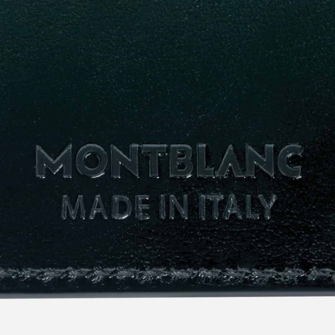 Close-up of a black leather Montblanc Meisterstuck 6cc Card Holder, part of the 100 Years Meisterstück capsule collection, embossed with "MONTBLANC" and "MADE IN ITALY," featuring visible stitching along the edge.