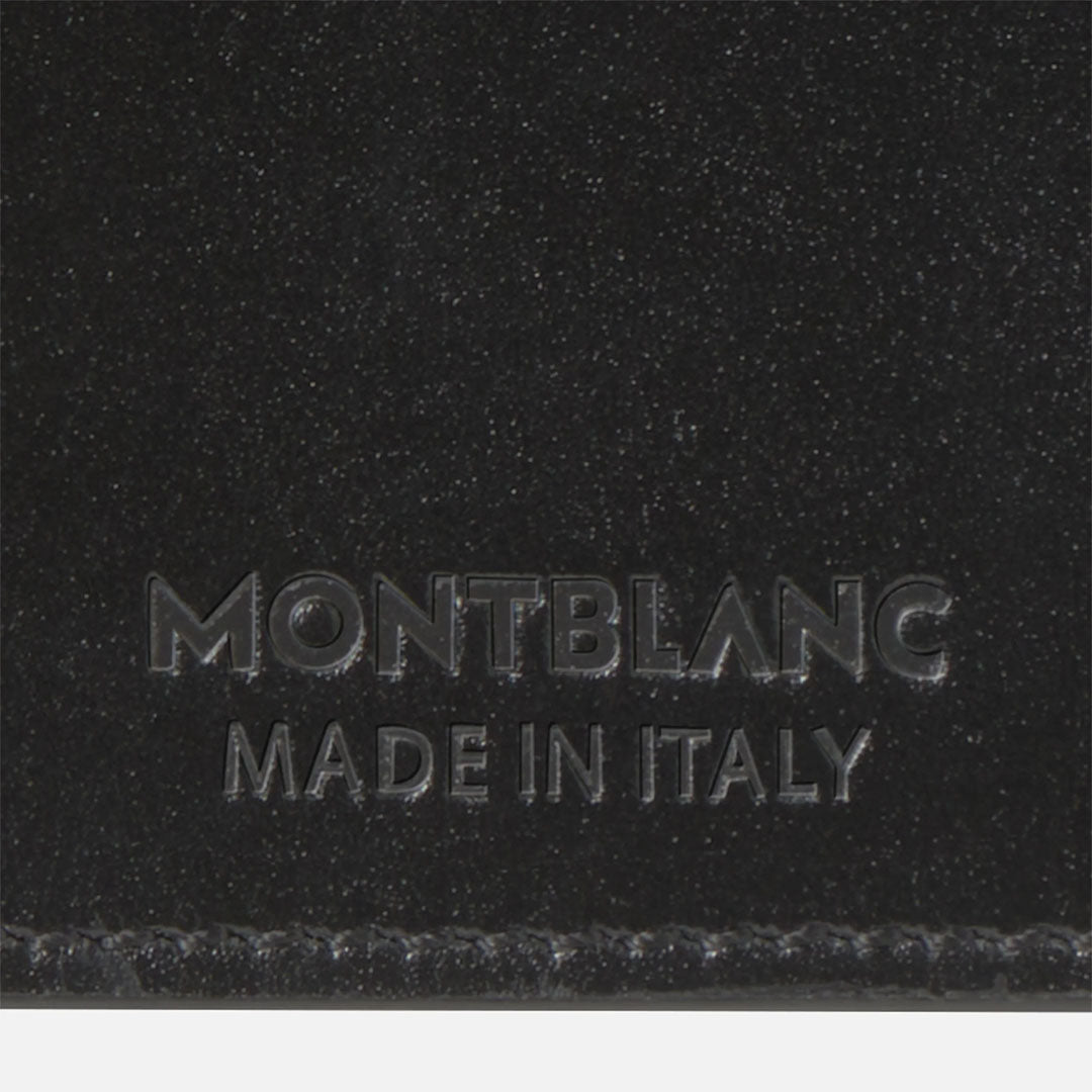 Close-up of the Montblanc Meisterstuck 4CC Leather Card Holder in black, featuring "MONTBLANC MADE IN ITALY" embossed near the bottom and fine edge stitching.
