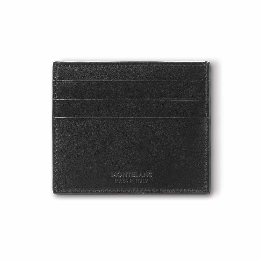 The Montblanc Meisterstück 6cc Leather Card Holder, a luxurious accessory crafted from black leather, features four card slots. Adorning the front is the iconic Montblanc logo along with a "Made in Italy" embossment, all set against a plain white background.